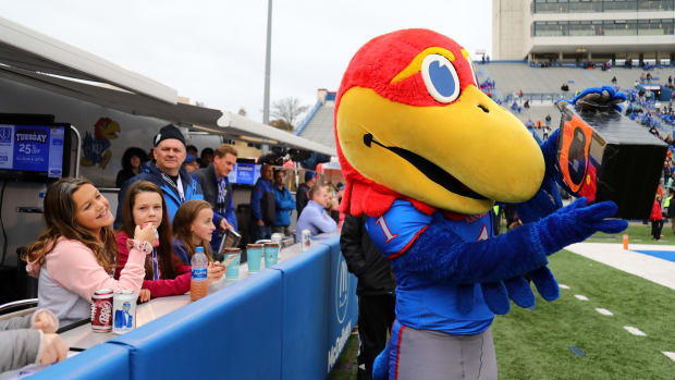 Nov 23, 2018; Lawrence, KS, USA; Kansas Jayhawks fans interact with mascot Big Jay in the second half against the Texas Longhorns at Memorial Stadium. Mandatory Credit: Jay Biggerstaff-USA TODAY Sports  
